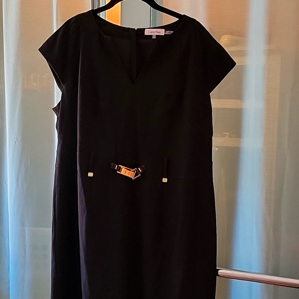 Black dress with gold buckle detail